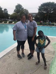 Two Timber Grove teachers and a student at the pool party.