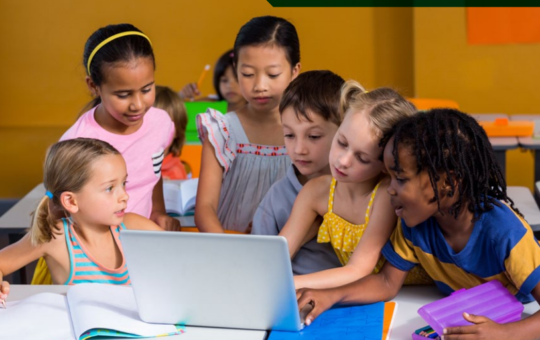 Diverse group of six children staring at a laptop computer.