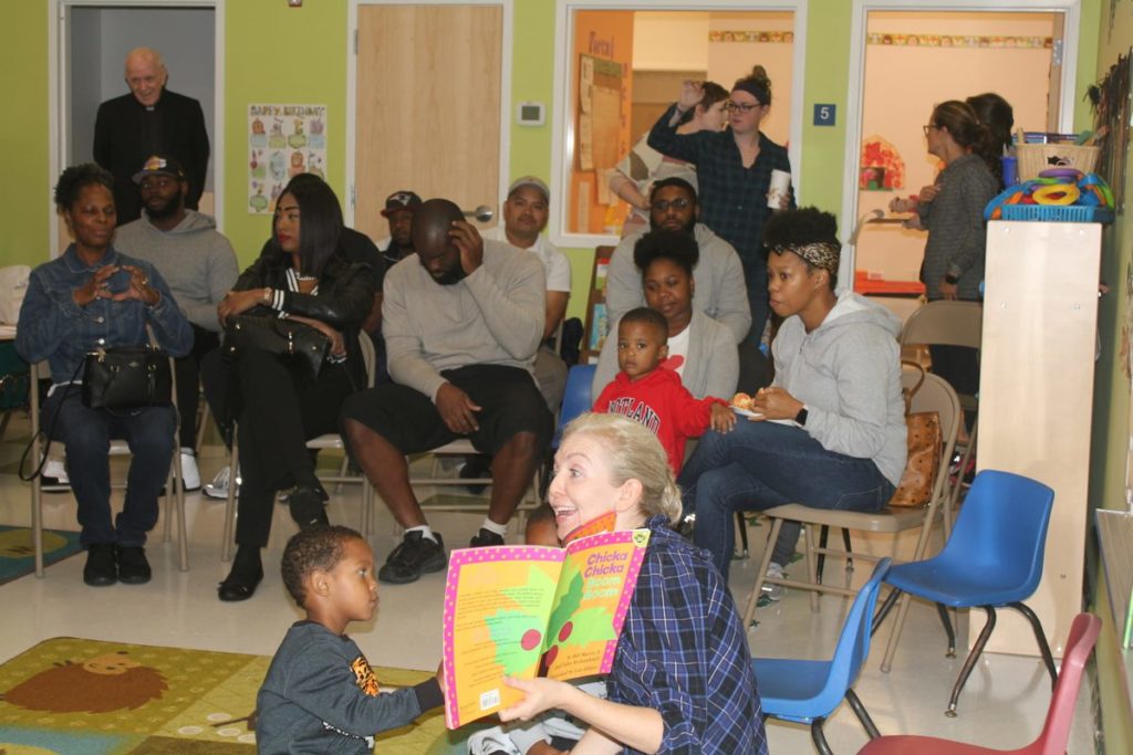 Parents and children participate in a class called "Read to Succeed" at Loyola Early Learning Center.