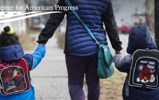 A mother walks home with her son and his cousin after child care in Burlington, Vermont.
