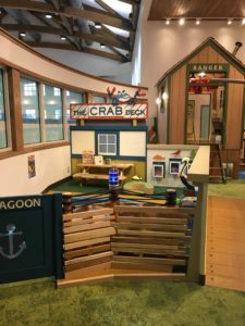 Imaginary scene at library with bridge, ranger station and restaurant sign