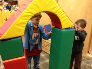 In Storyville, two boys build large structures.