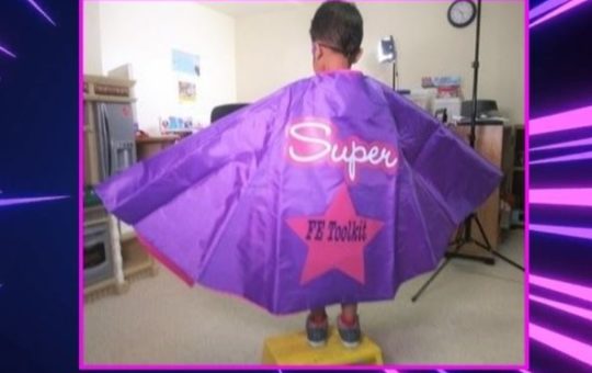 Boy in superhero cape that reads "Super FE Toolkit".