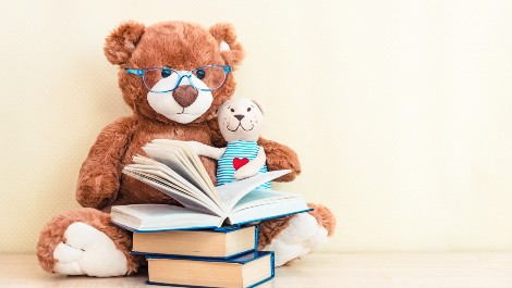 Build Baby's Brain With Books featuring a stuffed animals and books.