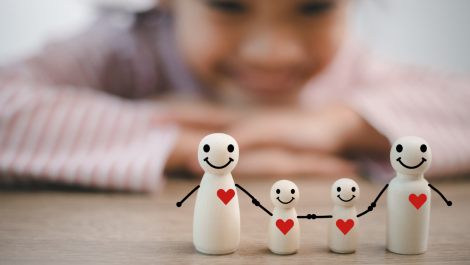 Mental Health Tips for Families featuring girl with family figurines.